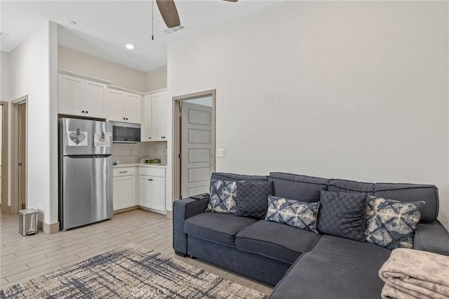 1938 N Frontier St, Hanford, CA 93230 - living room with a ceiling fan and wood tiled floors
