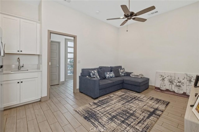 1938 N Frontier St, Hanford, CA 93230 - living room with wood finish floors, a ceiling fan, and bar