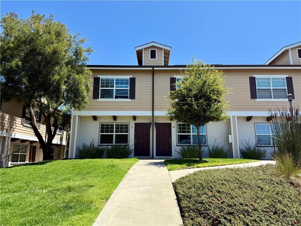 1043 Ella St Unit 9, San Luis Obispo, CA 93401 - colonial-style house with a front yard and stucco siding
