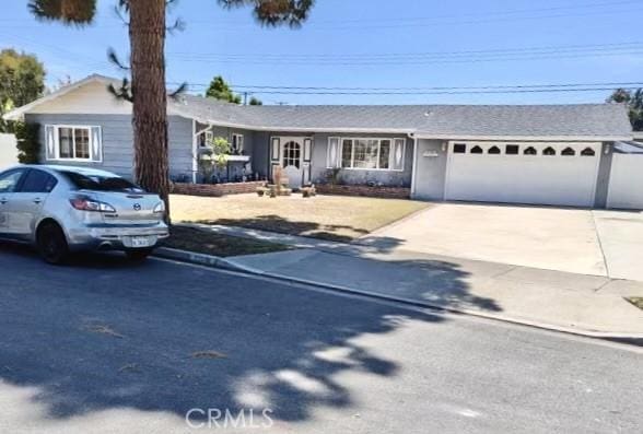 13941 Ward St, Garden Grove, CA 92843 - ranch-style house featuring a garage and concrete driveway
