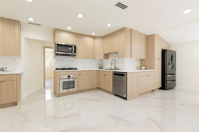11063 White Oak Ave, Granada Hills, CA 91344 - kitchen with light brown cabinets, appliances with stainless steel finishes, light marble finish floors, tasteful backsplash, and modern cabinets