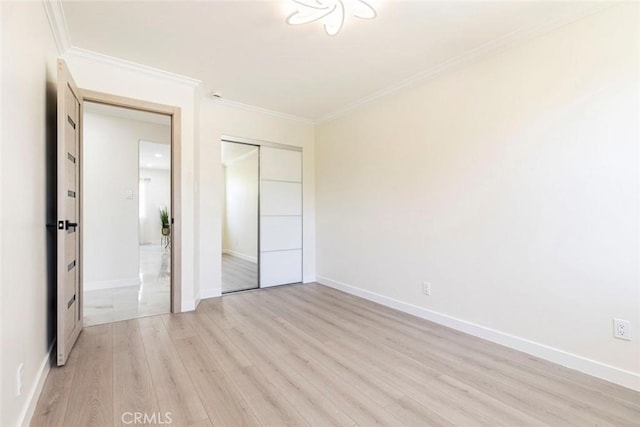 11063 White Oak Ave, Granada Hills, CA 91344 - unfurnished bedroom featuring light wood-style flooring, a closet, and ornamental molding