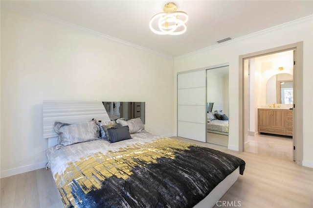 11063 White Oak Ave, Granada Hills, CA 91344 - bedroom featuring ornamental molding, a chandelier, wood finished floors, and a closet