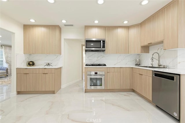 11063 White Oak Ave, Granada Hills, CA 91344 - kitchen with light brown cabinets, stainless steel appliances, modern cabinets, light marble finish floors, and decorative backsplash
