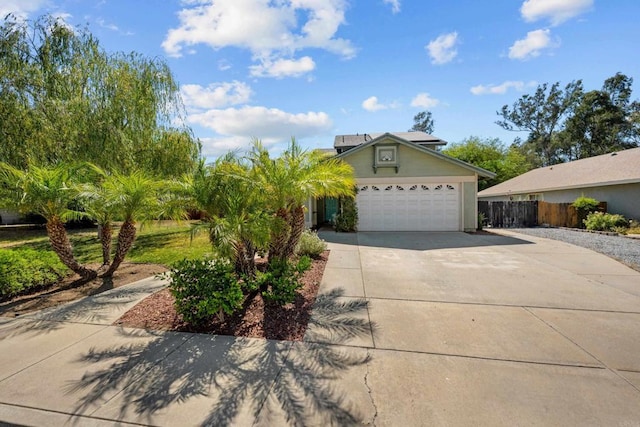 1161 Senwood Way, Fallbrook, CA 92028 - view of front facade featuring driveway, roof mounted solar panels, and a garage
