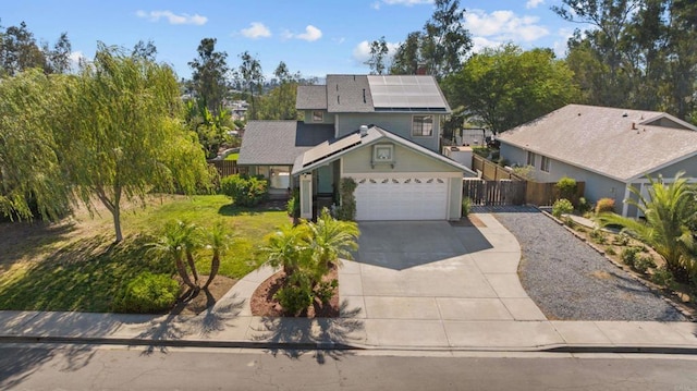 1161 Senwood Way, Fallbrook, CA 92028 - traditional home featuring concrete driveway, roof mounted solar panels, and an attached garage