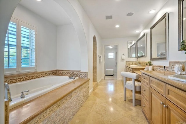 14317 Salida Del Sol, San Diego, CA 92127 - full bath featuring plenty of natural light, vanity, a garden tub, a walk in shower, and recessed lighting