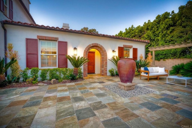 14317 Salida Del Sol, San Diego, CA 92127 - mediterranean / spanish-style house featuring a patio area, an outdoor hangout area, stucco siding, and a chimney