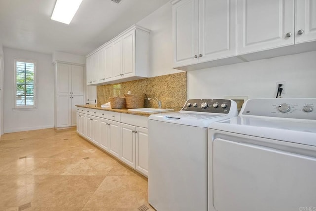 14317 Salida Del Sol, San Diego, CA 92127 - laundry area with cabinet space and washer and dryer
