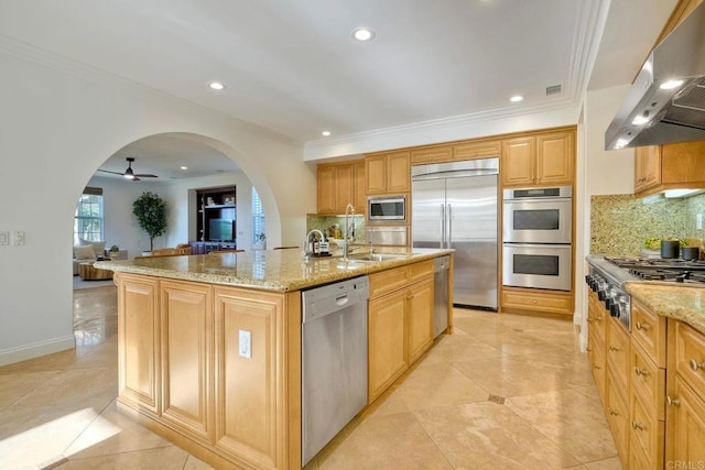 14317 Salida Del Sol, San Diego, CA 92127 - kitchen featuring built in appliances, extractor fan, arched walkways, light stone countertops, and tasteful backsplash