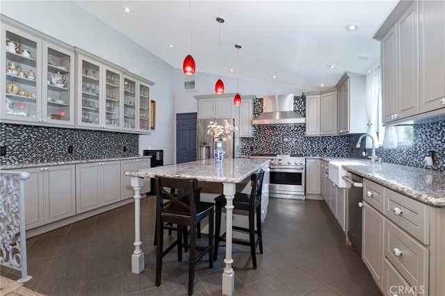 2350 Oak Park Rd, Glendora, CA 91741 - kitchen with appliances with stainless steel finishes, wall chimney exhaust hood, decorative backsplash, a kitchen island, and vaulted ceiling