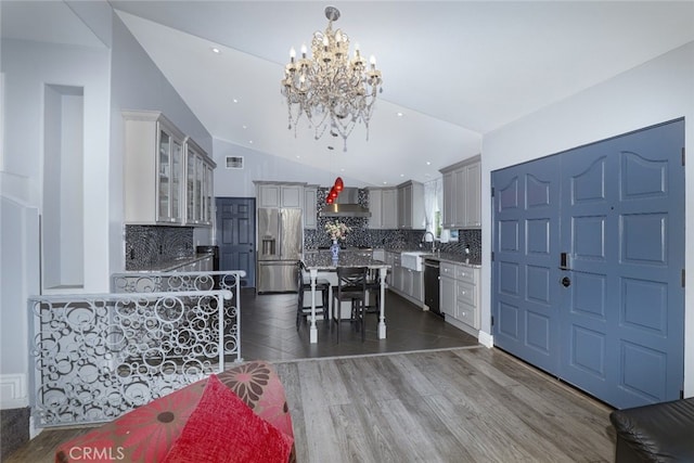 2350 Oak Park Rd, Glendora, CA 91741 - kitchen with appliances with stainless steel finishes, wall chimney range hood, lofted ceiling, a chandelier, and decorative backsplash