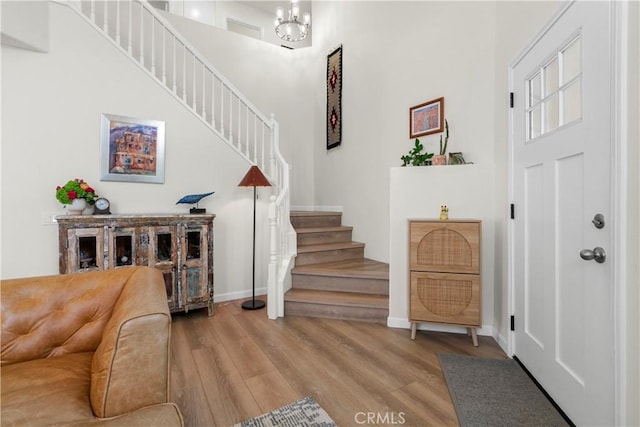 401 Lupine Way, Oceanside, CA 92057 - entryway featuring stairs, wood finished floors, a high ceiling, and a chandelier