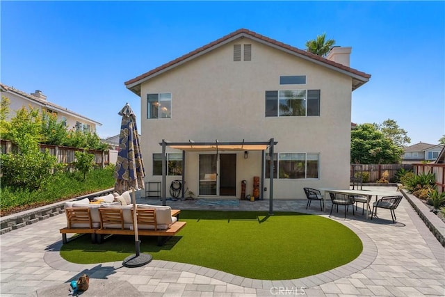 401 Lupine Way, Oceanside, CA 92057 - rear view of house with an outdoor hangout area, a pergola, stucco siding, and a fenced backyard