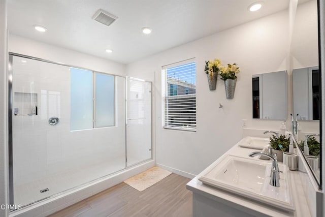 1979 Tangelo Way, Santa Paula, CA 93060 - full bathroom with a shower stall, double vanity, wood finished floors, and recessed lighting