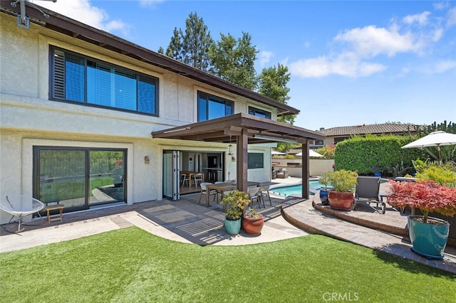 1579 Via Parque, Thousand Oaks, CA 91360 - rear view of property featuring a patio area, stucco siding, and a yard