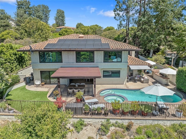 1579 Via Parque, Thousand Oaks, CA 91360 - rear view of house with a patio area, roof mounted solar panels, a fenced backyard, an outdoor living space, and a tile roof