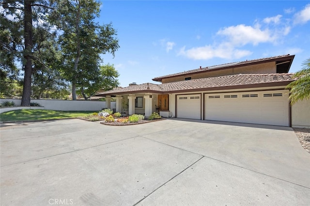 1579 Via Parque, Thousand Oaks, CA 91360 - view of front of property featuring concrete driveway, a garage, a tile roof, and stucco siding