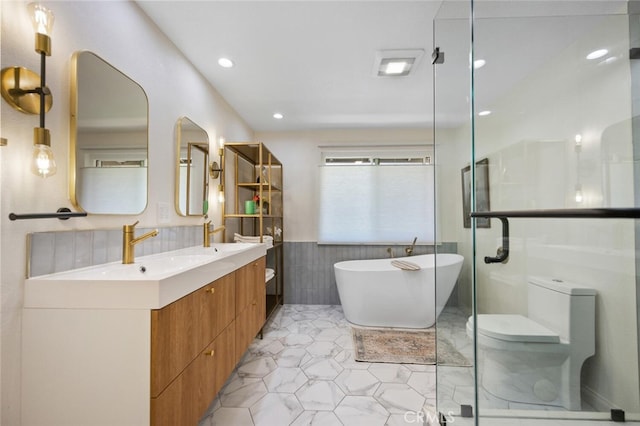 1579 Via Parque, Thousand Oaks, CA 91360 - bathroom featuring tile walls, a soaking tub, double vanity, recessed lighting, and a wainscoted wall