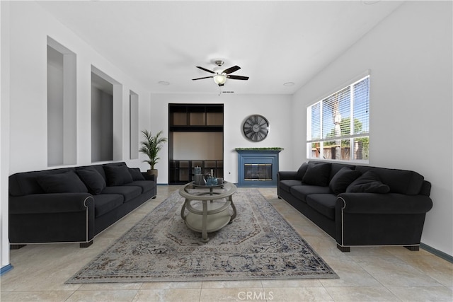 32522 Safflower St, Winchester, CA 92596 - living room featuring a glass covered fireplace and a ceiling fan