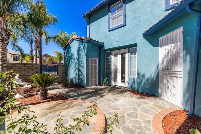 32522 Safflower St, Winchester, CA 92596 - back of property with french doors, stucco siding, and a patio