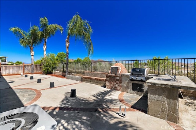 32522 Safflower St, Winchester, CA 92596 - fenced backyard featuring an outdoor kitchen and a patio area