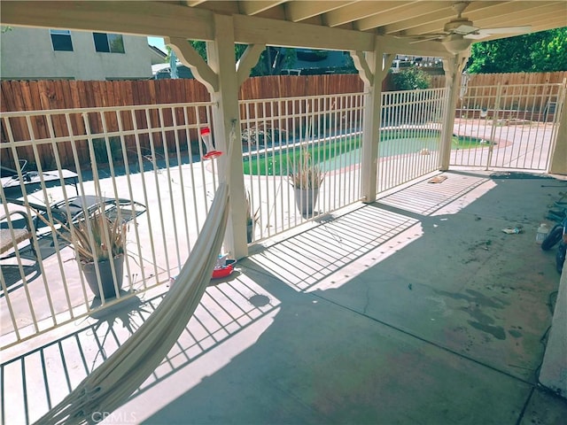 38644 Palms Pl, Palmdale, CA 93552 - fenced backyard with a patio area and a ceiling fan