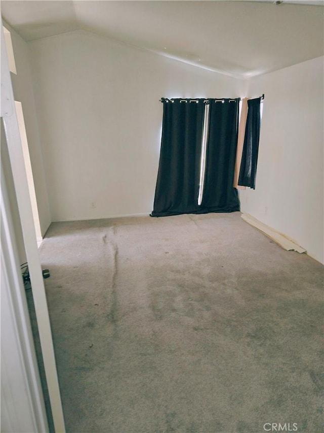 38644 Palms Pl, Palmdale, CA 93552 - spare room featuring lofted ceiling and light carpet
