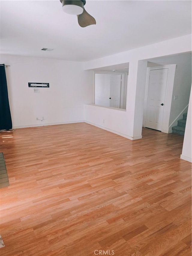 38644 Palms Pl, Palmdale, CA 93552 - spare room featuring stairway, ceiling fan, and light wood-style floors
