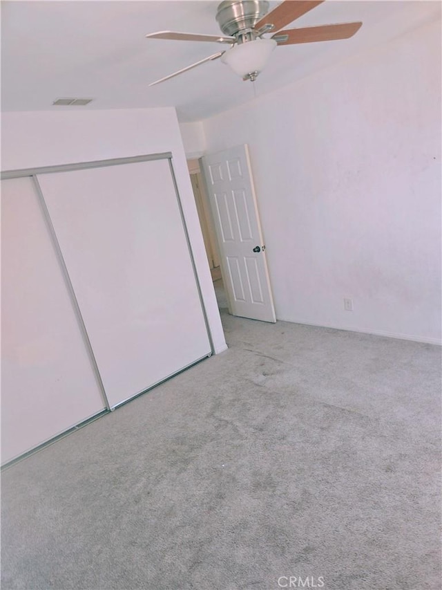 38644 Palms Pl, Palmdale, CA 93552 - unfurnished bedroom featuring carpet, a closet, and a ceiling fan