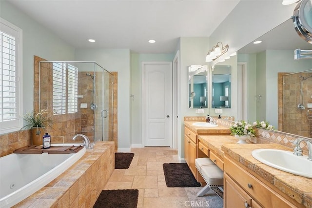 29160 Harmony Way, Saugus, CA 91390 - full bathroom featuring a stall shower, a whirlpool tub, double vanity, stone tile flooring, and recessed lighting