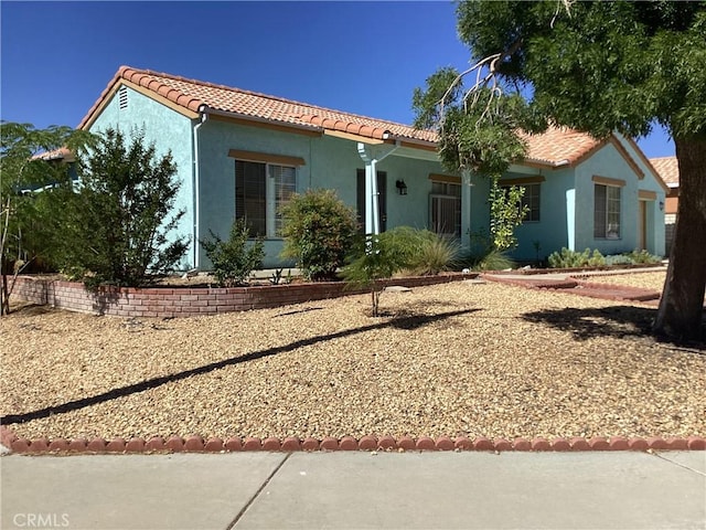 13489 Buggy Whip Ct, Victorville, CA 92392 - mediterranean / spanish house featuring a tiled roof and stucco siding