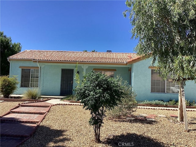 13489 Buggy Whip Ct, Victorville, CA 92392 - view of front facade with a tiled roof and stucco siding