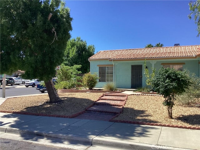 13489 Buggy Whip Ct, Victorville, CA 92392 - view of front of house featuring a tiled roof and stucco siding