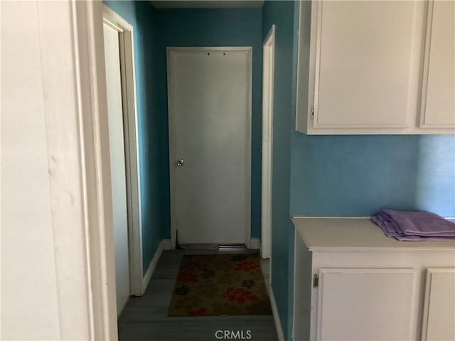 13489 Buggy Whip Ct, Victorville, CA 92392 - laundry room with baseboards and wood finished floors