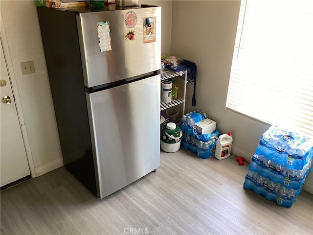 13489 Buggy Whip Ct, Victorville, CA 92392 - laundry area with wood finished floors