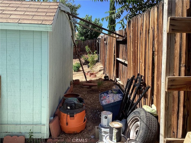 13489 Buggy Whip Ct, Victorville, CA 92392 - view of side of property featuring a storage shed and a fenced backyard