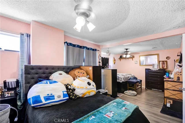 20290 E Arrow Unit C, Covina, CA 91724 - bedroom with wood finished floors, a textured ceiling, and a ceiling fan