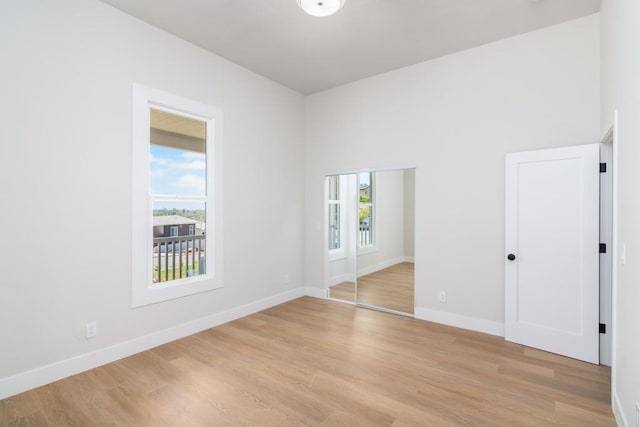 7284 W Point Ave, La Mesa, CA 91942 - unfurnished bedroom featuring light wood finished floors and two closets