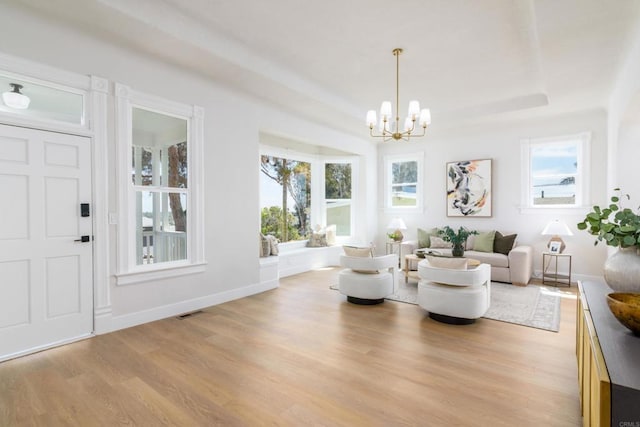 7284 W Point Ave, La Mesa, CA 91942 - sitting room featuring light wood-style flooring, a chandelier, and a tray ceiling