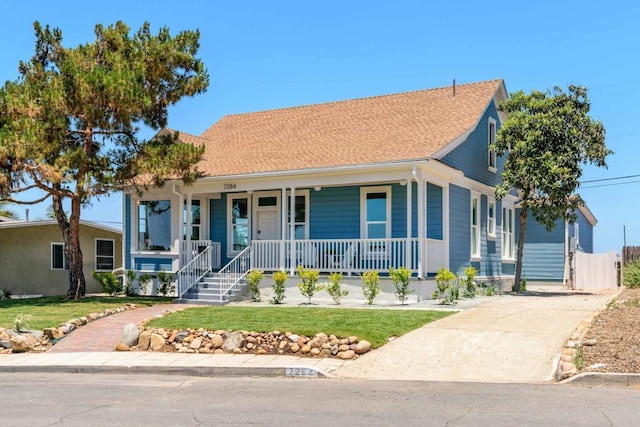 7284 W Point Ave, La Mesa, CA 91942 - view of front of home with a porch, a front yard, and driveway