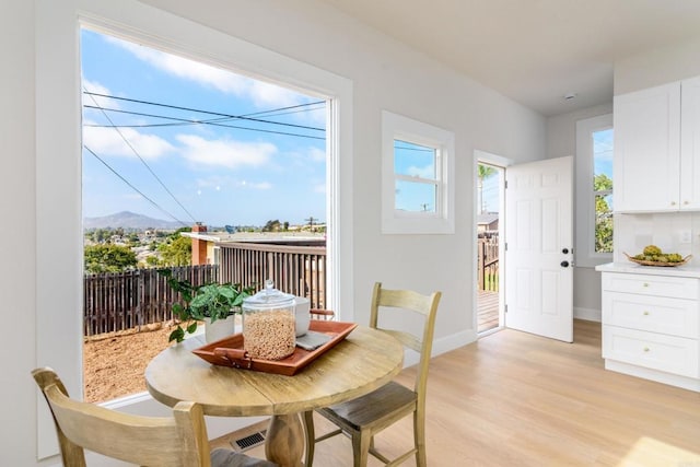 7284 W Point Ave, La Mesa, CA 91942 - dining room with light wood-style flooring and a mountain view