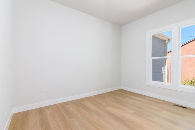 7284 W Point Ave, La Mesa, CA 91942 - empty room with light wood-style flooring and baseboards