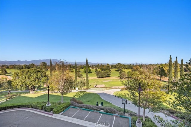 3253 San Amadeo Unit P, Laguna Woods, CA 92637 - view of community with a yard, a mountain view, uncovered parking, and view of golf course