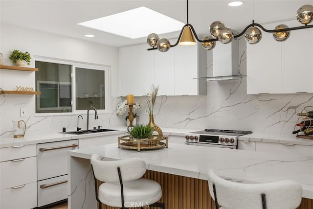 3253 San Amadeo Unit P, Laguna Woods, CA 92637 - kitchen with stainless steel stove, modern cabinets, wall chimney exhaust hood, white cabinets, and recessed lighting