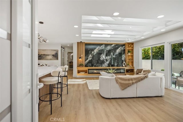 3253 San Amadeo Unit P, Laguna Woods, CA 92637 - living room with light wood-style flooring, recessed lighting, and beamed ceiling