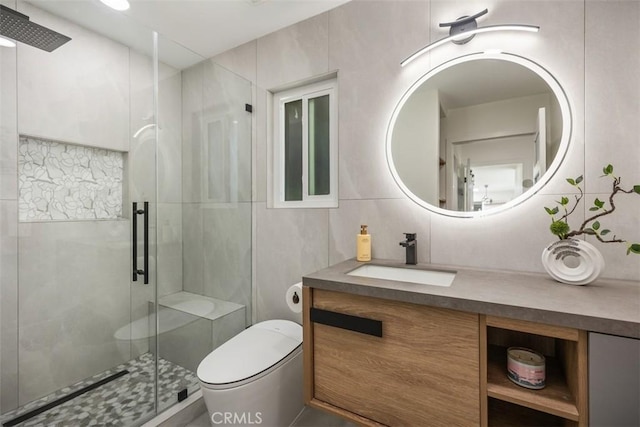 3253 San Amadeo Unit P, Laguna Woods, CA 92637 - bathroom featuring vanity, a shower stall, and tile walls