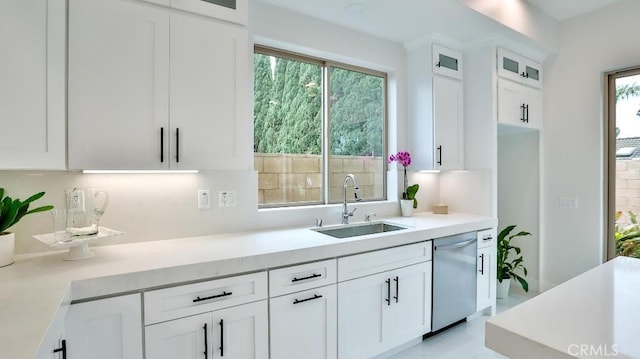17413 Siena Ln, Fountain Valley, CA 92708 - kitchen featuring dishwasher, white cabinets, glass insert cabinets, and light countertops