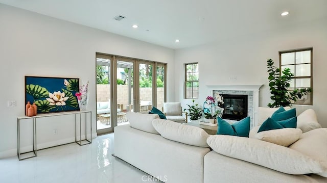 17413 Siena Ln, Fountain Valley, CA 92708 - living room with french doors, recessed lighting, a premium fireplace, and marble finish floors