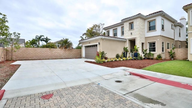 17413 Siena Ln, Fountain Valley, CA 92708 - view of front of home featuring stucco siding, a tiled roof, an attached garage, and driveway